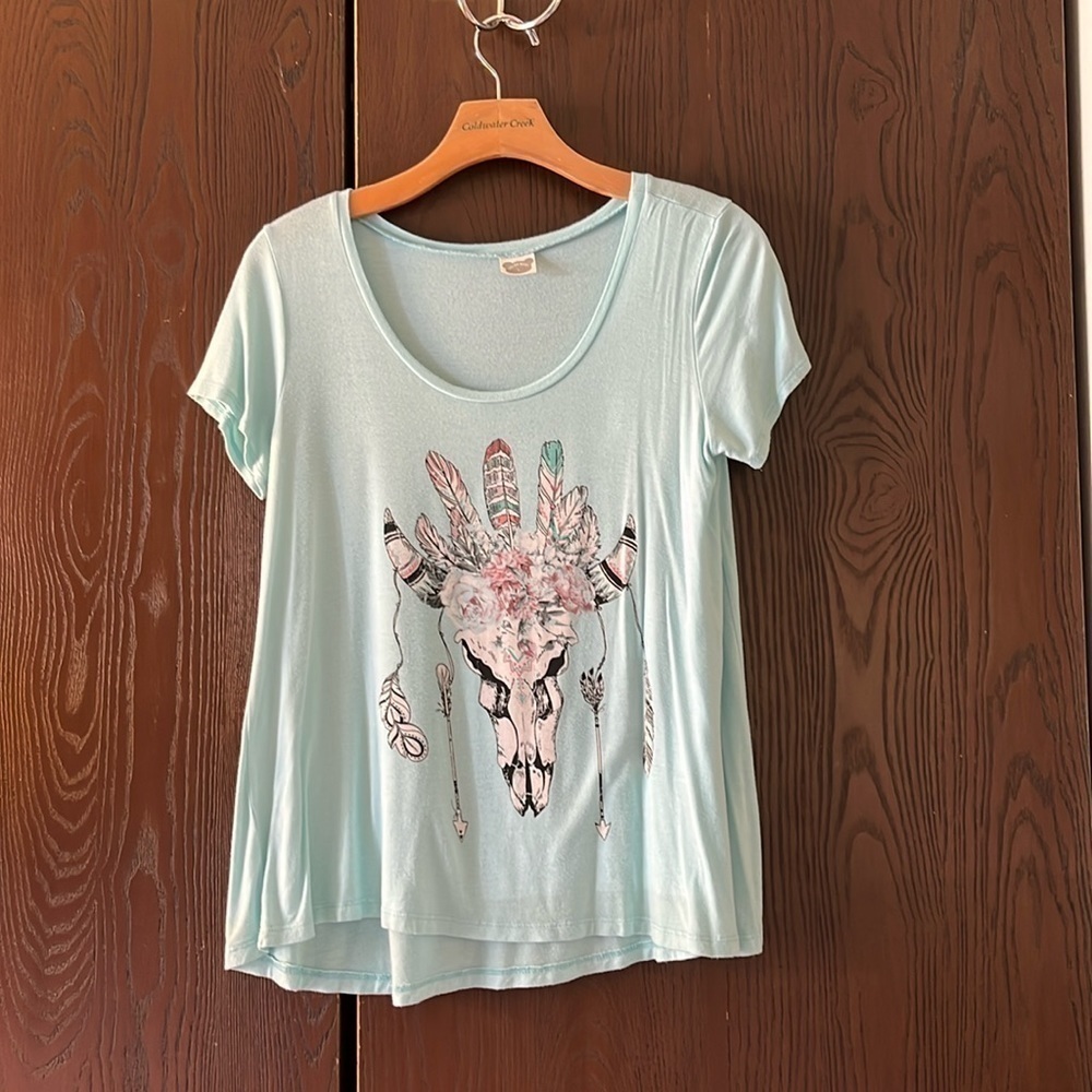 Color Bear turquoise, short sleeved top with skeleton and feathers. Size Large.